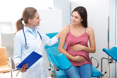 Pregnant woman having appointment at gynecologist office