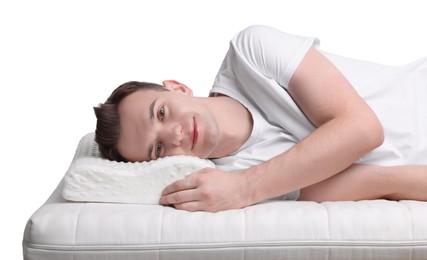 Photo of Man lying on orthopedic pillow against white background