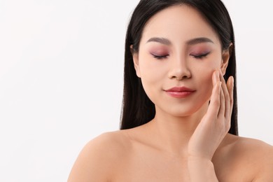 Portrait of beautiful woman on white background