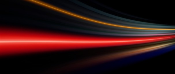 Image of Colorful speed light trails on black background, motion blur effect. Banner design