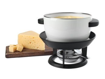 Photo of Fondue with tasty melted cheese and pieces isolated on white