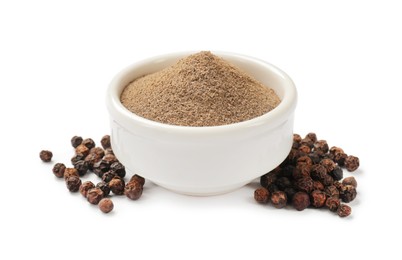 Photo of Aromatic spice. Ground and whole black pepper isolated on white