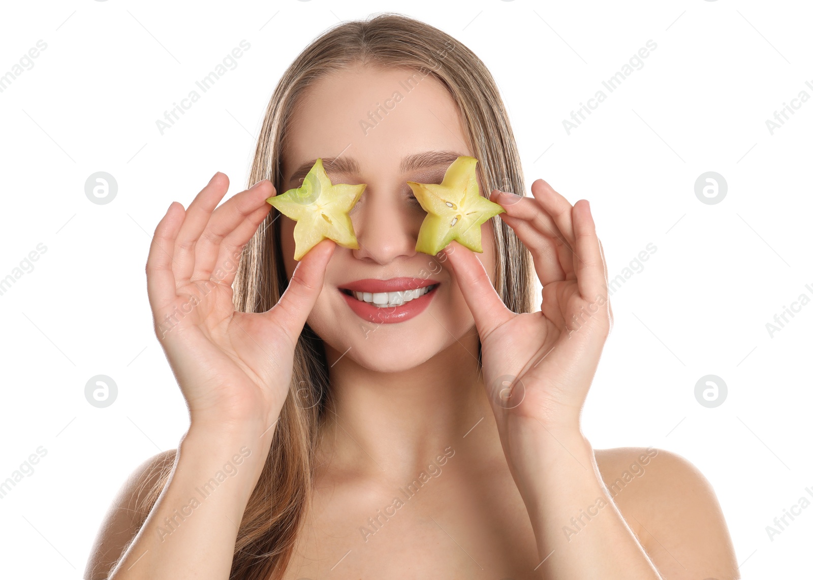 Photo of Young woman with cut carambola on white background. Vitamin rich food