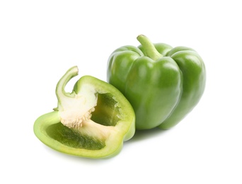 Photo of Cut and whole fresh green bell peppers isolated on white