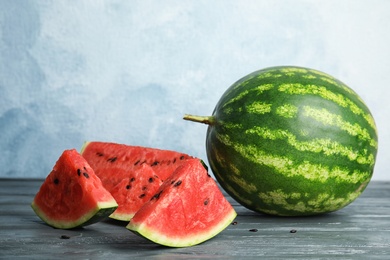 Fresh juicy watermelon with seeds on wooden table