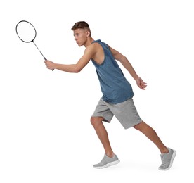 Young man playing badminton with racket on white background