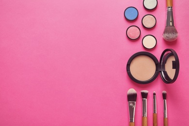 Flat lay composition with products for decorative makeup on pink background