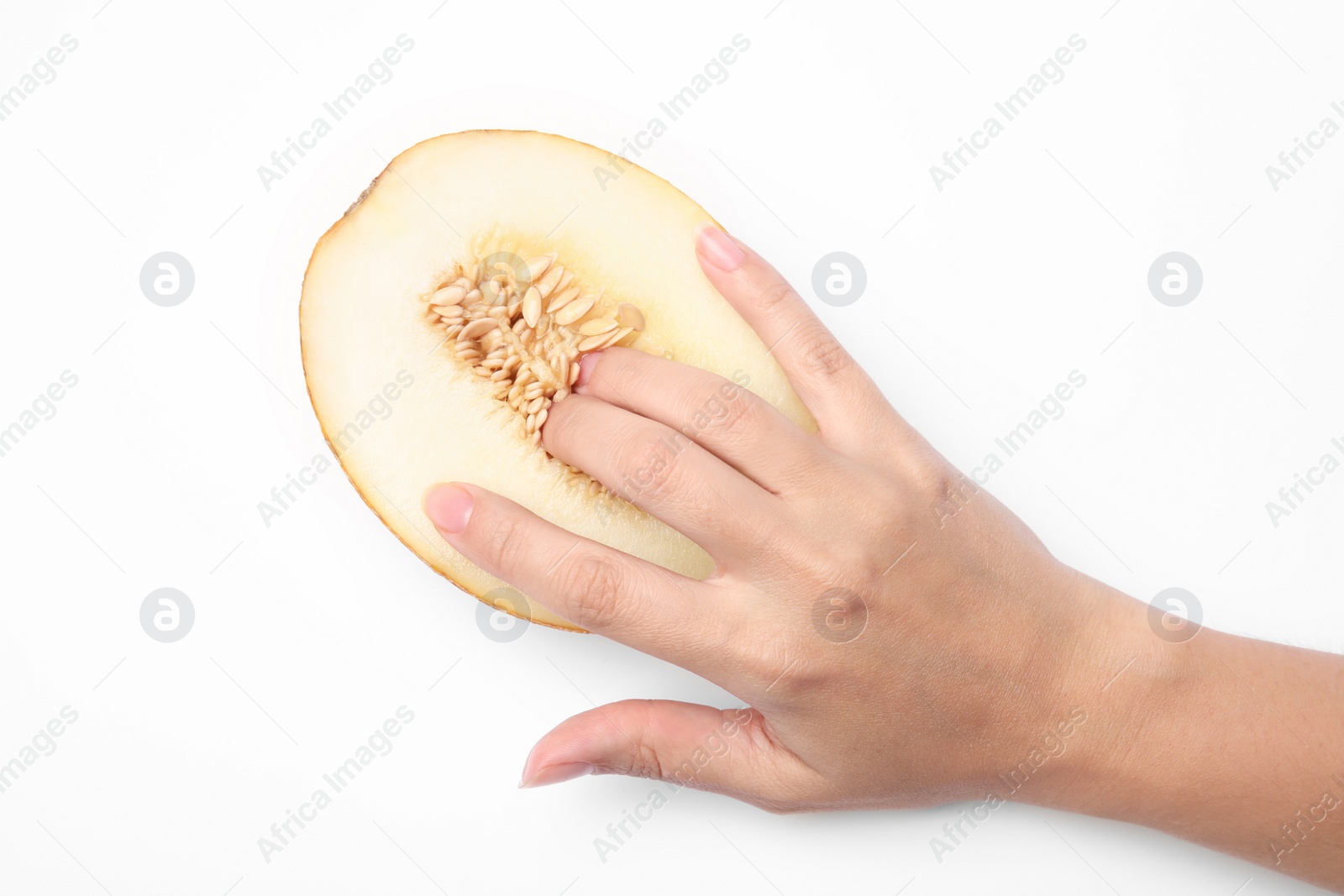 Photo of Young woman touching half of melon on white background, top view. Sex concept