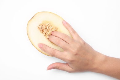 Young woman touching half of melon on white background, top view. Sex concept