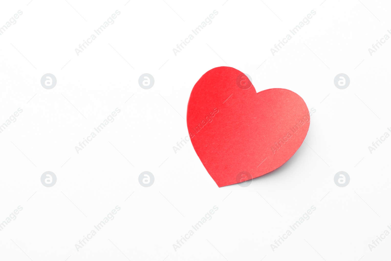 Photo of One paper heart on white background, top view. Space for text