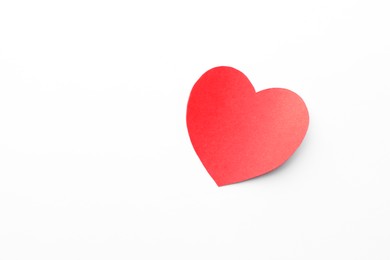 Photo of One paper heart on white background, top view. Space for text