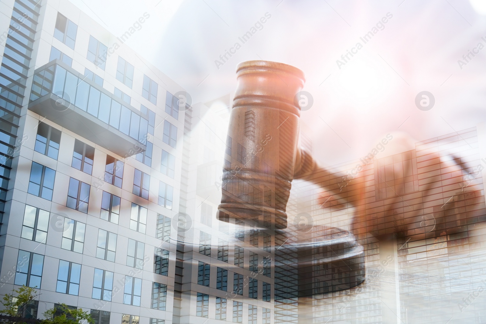Image of Law protection. Double exposure of judge with gavel and building
