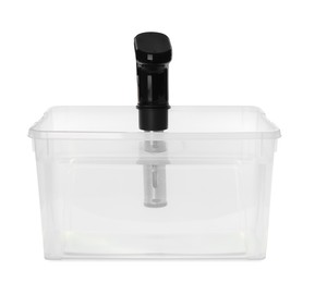 Photo of Thermal immersion circulator in plastic container with water isolated on white. Sous vide cooker