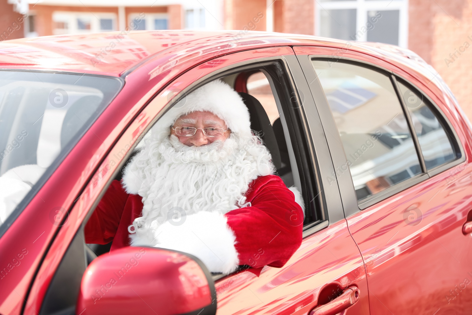 Photo of Authentic Santa Claus in car, view from outside