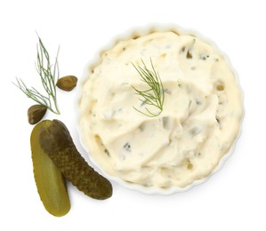 Photo of Tartar sauce and ingredients on white background, top view
