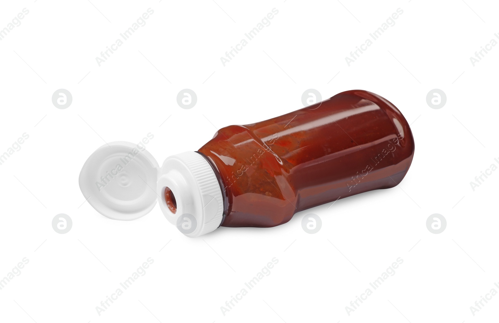 Photo of Bottle of tasty ketchup isolated on white