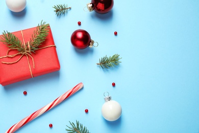 Flat lay composition with Christmas decorations on light blue background