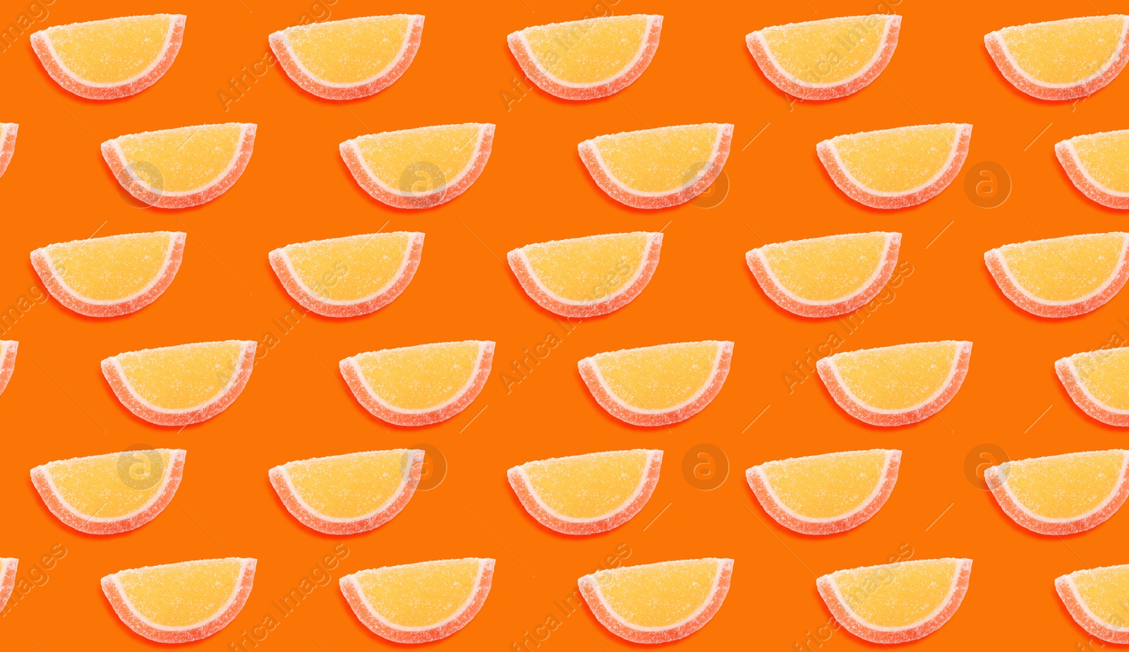 Image of Tasty jelly candies on orange background. Pattern design