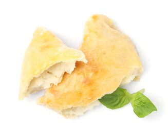 Photo of Delicious samosa and basil isolated on white, top view. Homemade pastry
