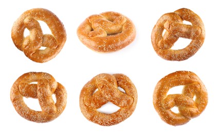 Image of Set with tasty freshly baked pretzels on white background