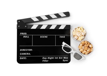 Movie clapper, buckets of tasty popcorn and glasses isolated on white, top view