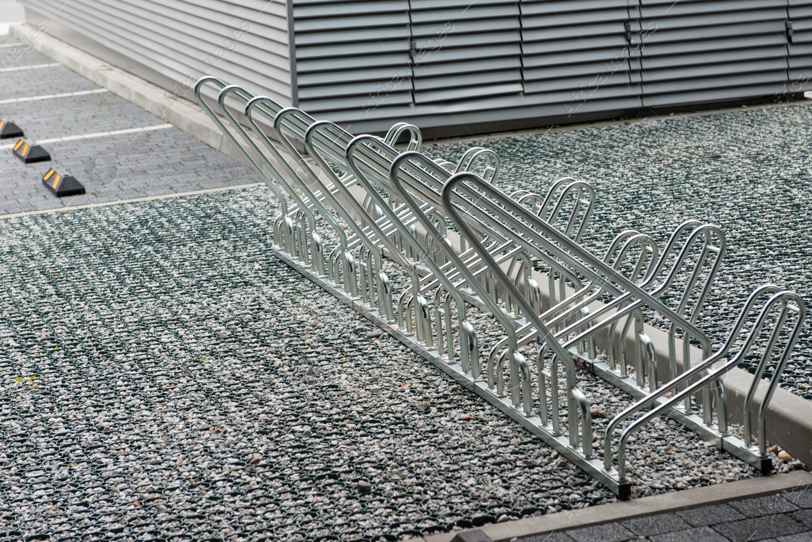 Photo of Empty metal parking rack for bicycles outdoors