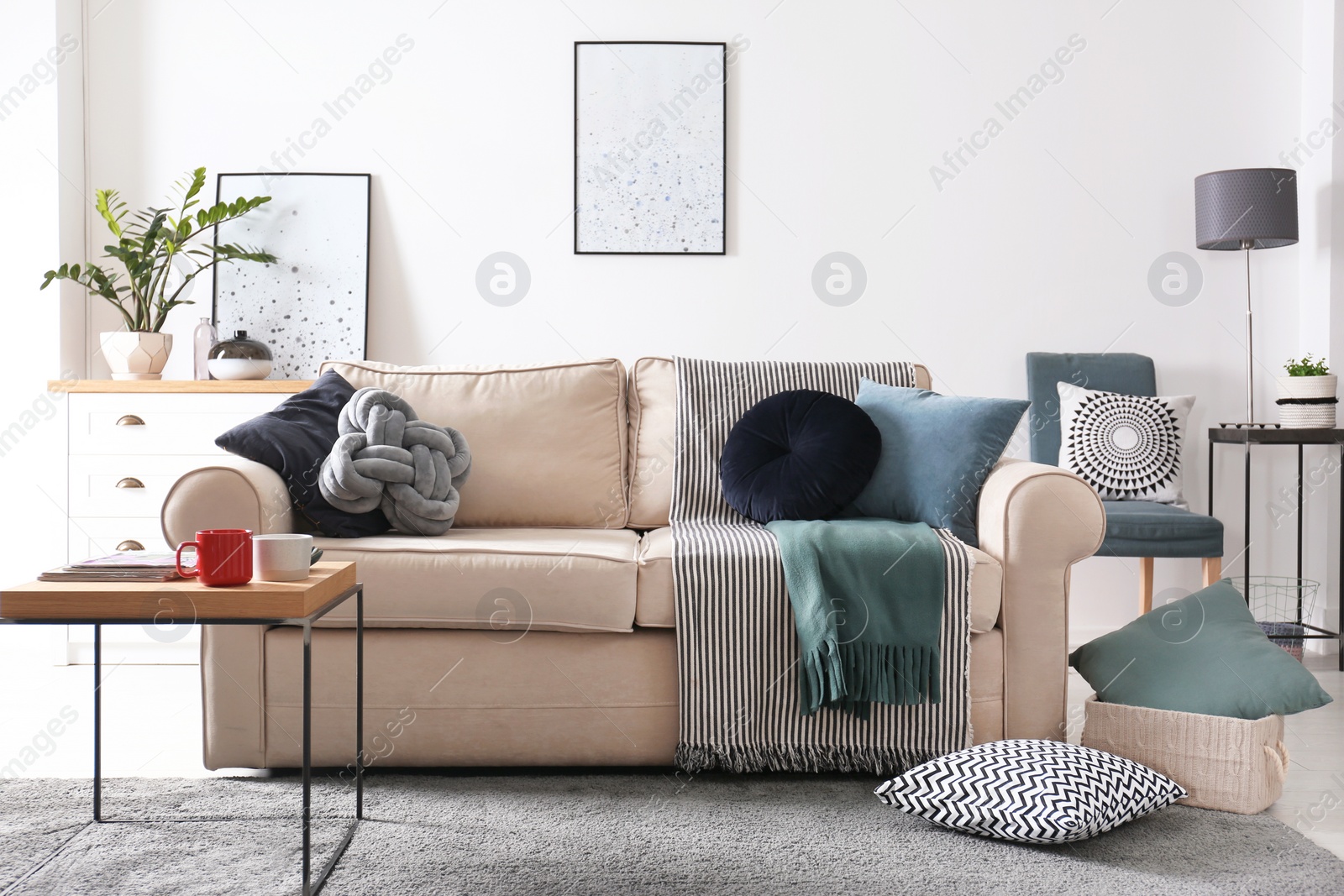 Photo of Living room interior with comfortable sofa and pillows