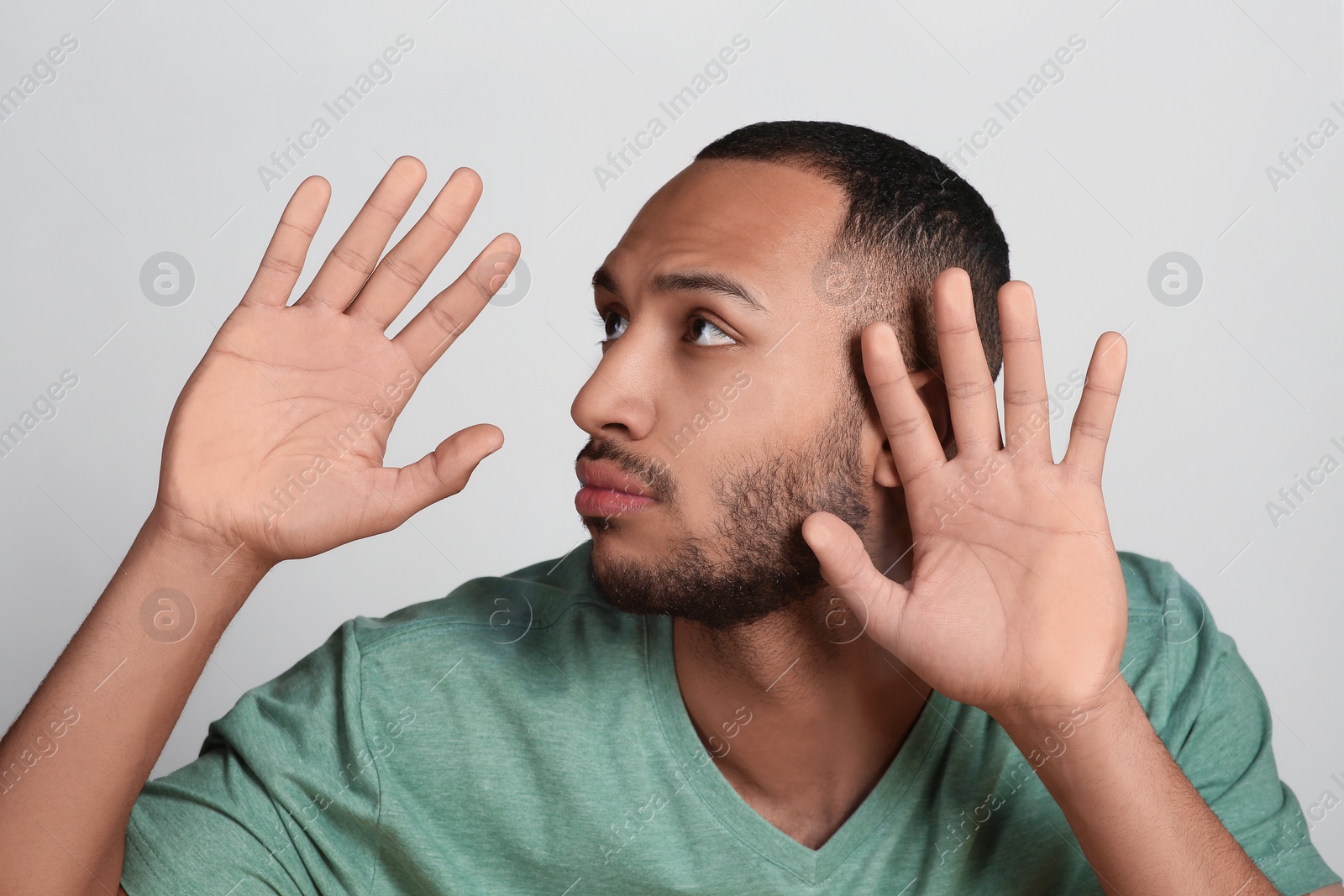 Photo of Young man stuck to transparent screen. Internet addiction concept