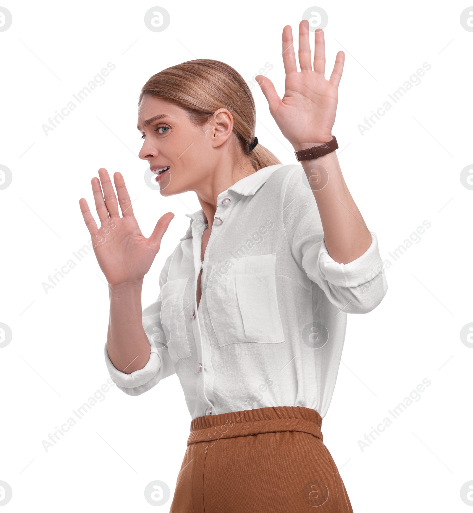Photo of Beautiful emotional businesswoman avoiding something on white background