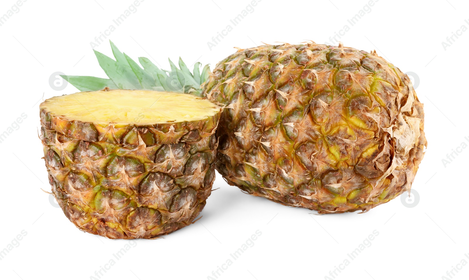 Photo of Whole and cut tasty ripe pineapples isolated on white