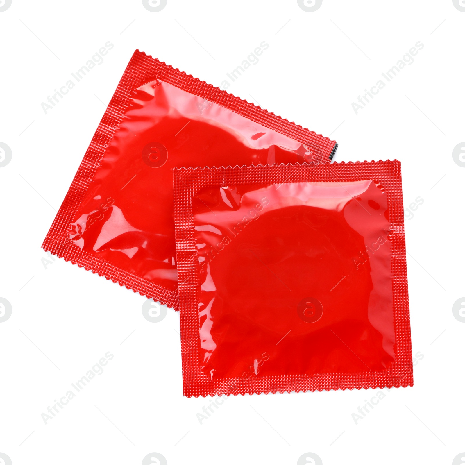 Photo of Condom packages isolated on white, top view. Safe sex