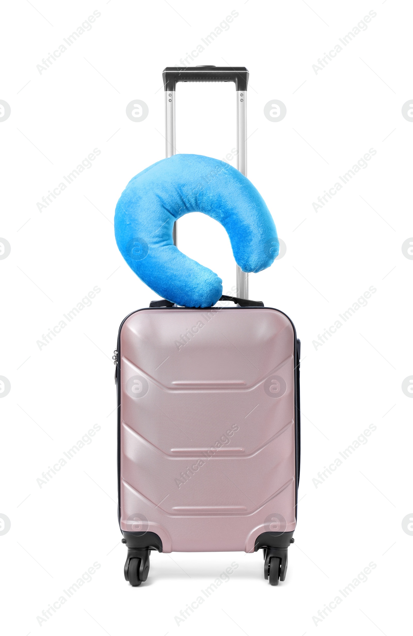 Photo of Soft travel pillow on suitcase isolated on white