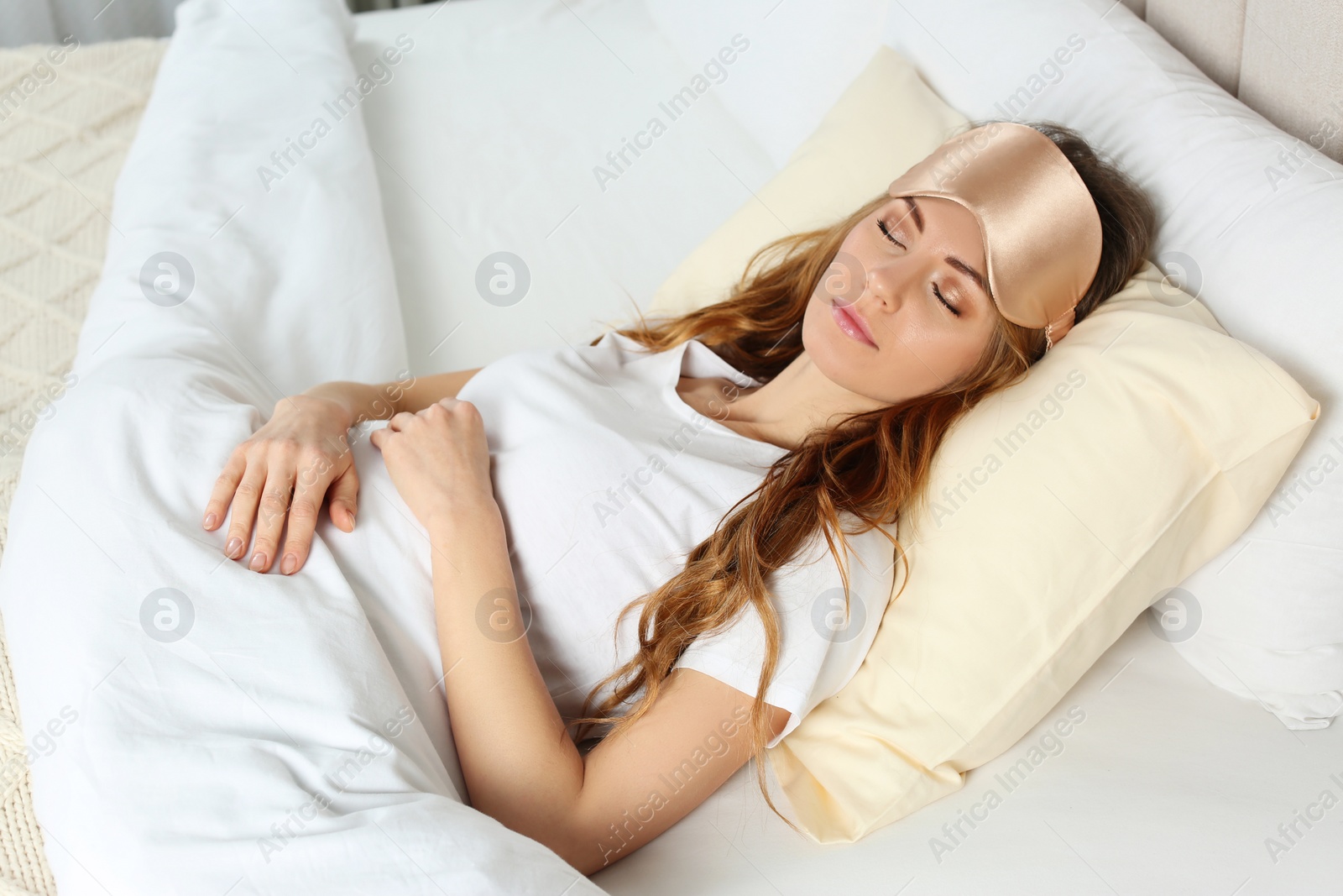 Photo of Beautiful woman sleeping in bed at home