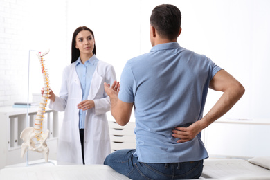 Man visiting professional orthopedist in medical office