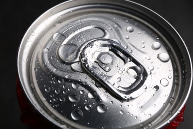 Photo of Energy drink in wet can, closeup. Functional beverage