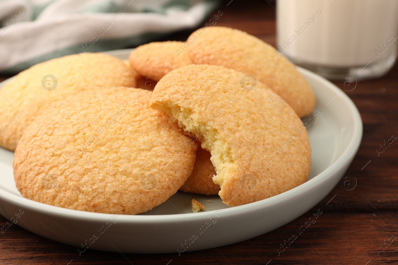Photo of Delicious Danish butter cookies on wooden table, closeup