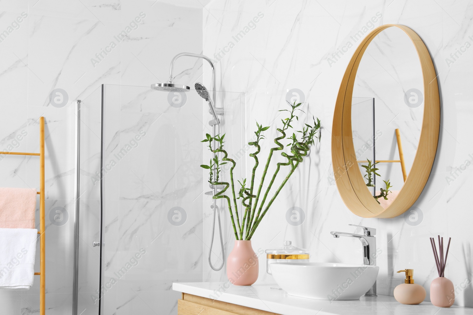 Photo of Stylish bathroom interior with beautiful green bamboo