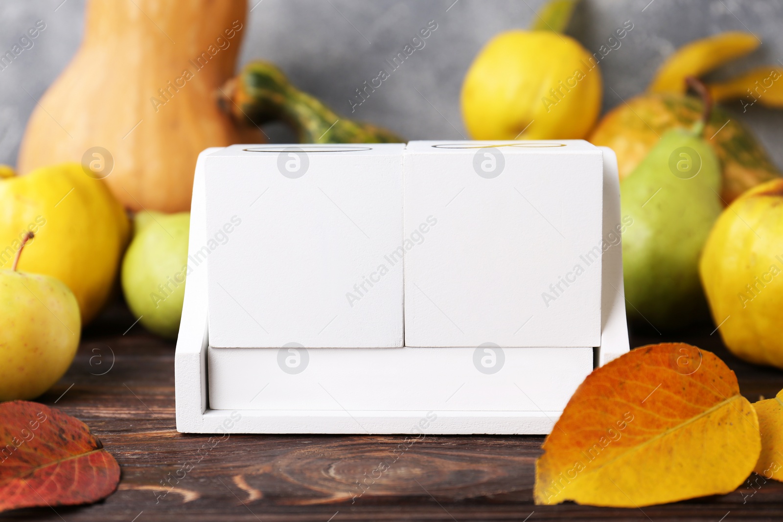 Photo of Thanksgiving day, holiday celebrated every fourth Thursday in November. Block calendar, fruits, vegetables and autumn leaves on wooden table