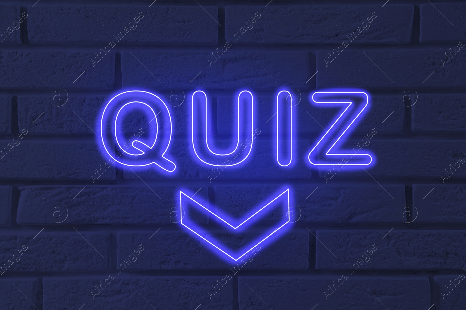 Image of Word QUIZ made of neon letters on dark brick background