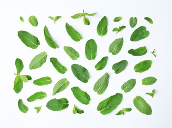 Flat lay composition with fresh green mint leaves on white background