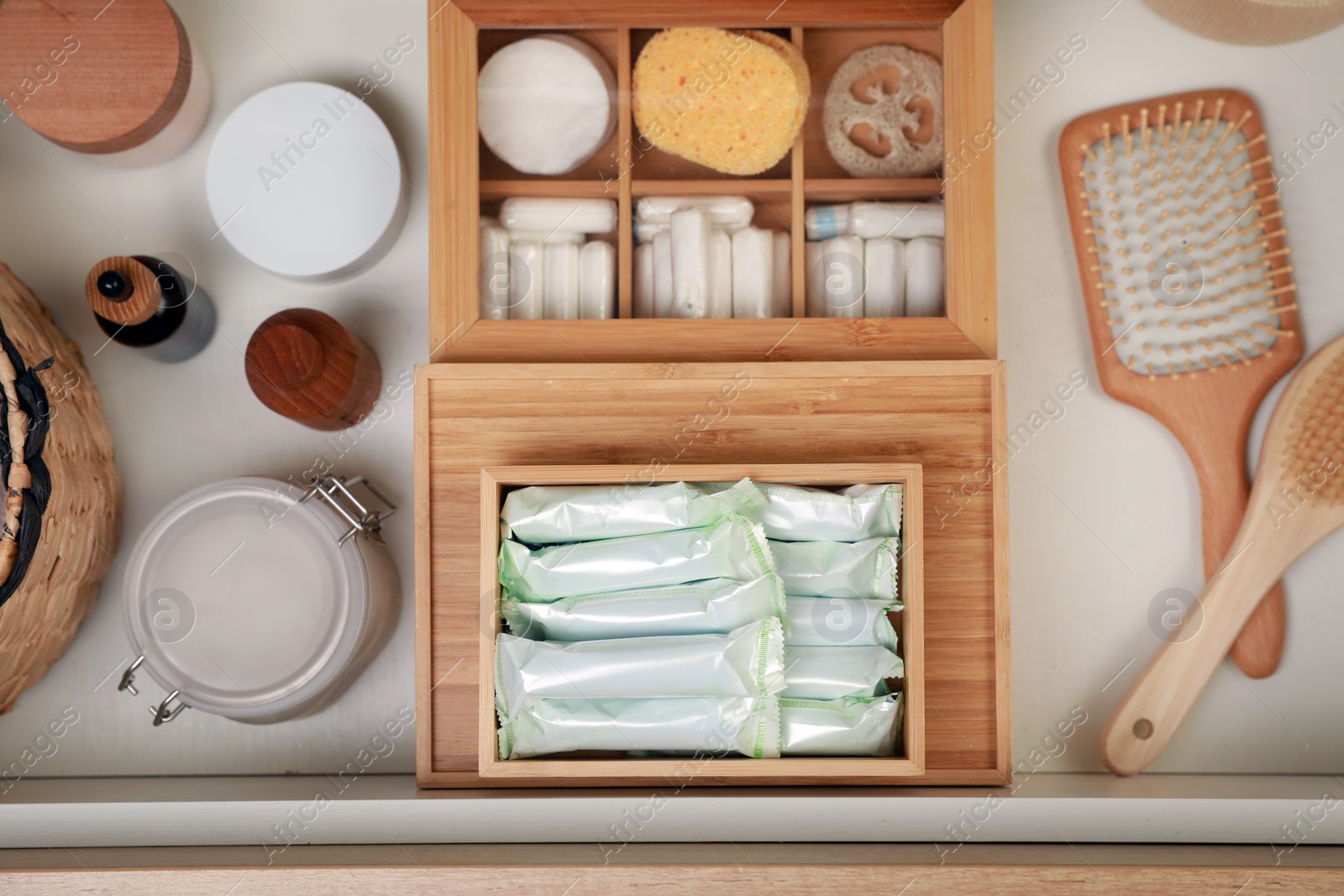 Photo of Keeping tampons and other self care products in drawer, flat lay