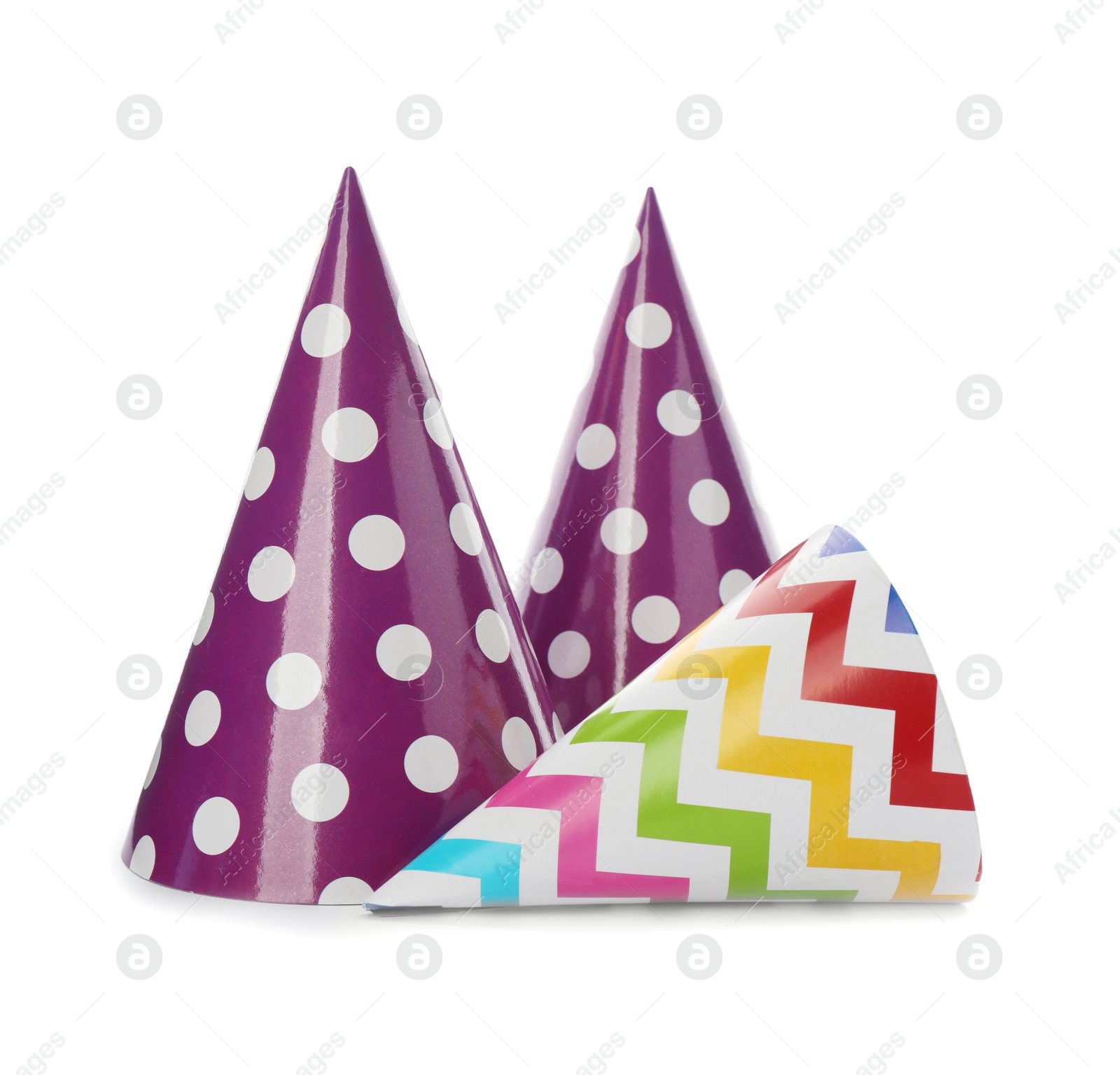 Photo of Bright party hats on white background. Festive accessory