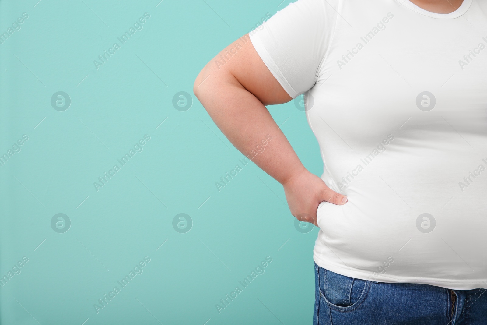 Photo of Overweight woman on color background