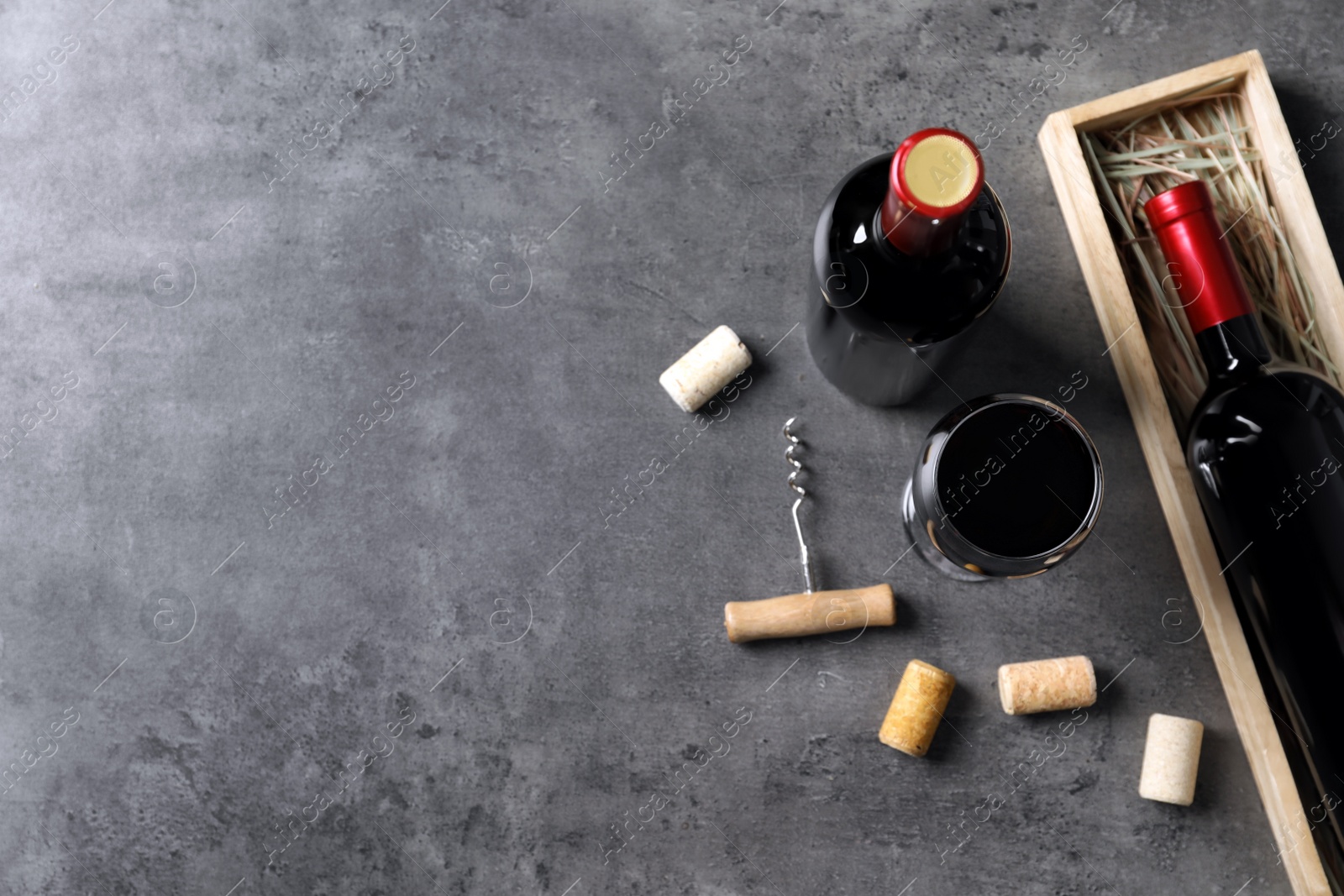 Photo of Flat lay composition with delicious red wine on grey background