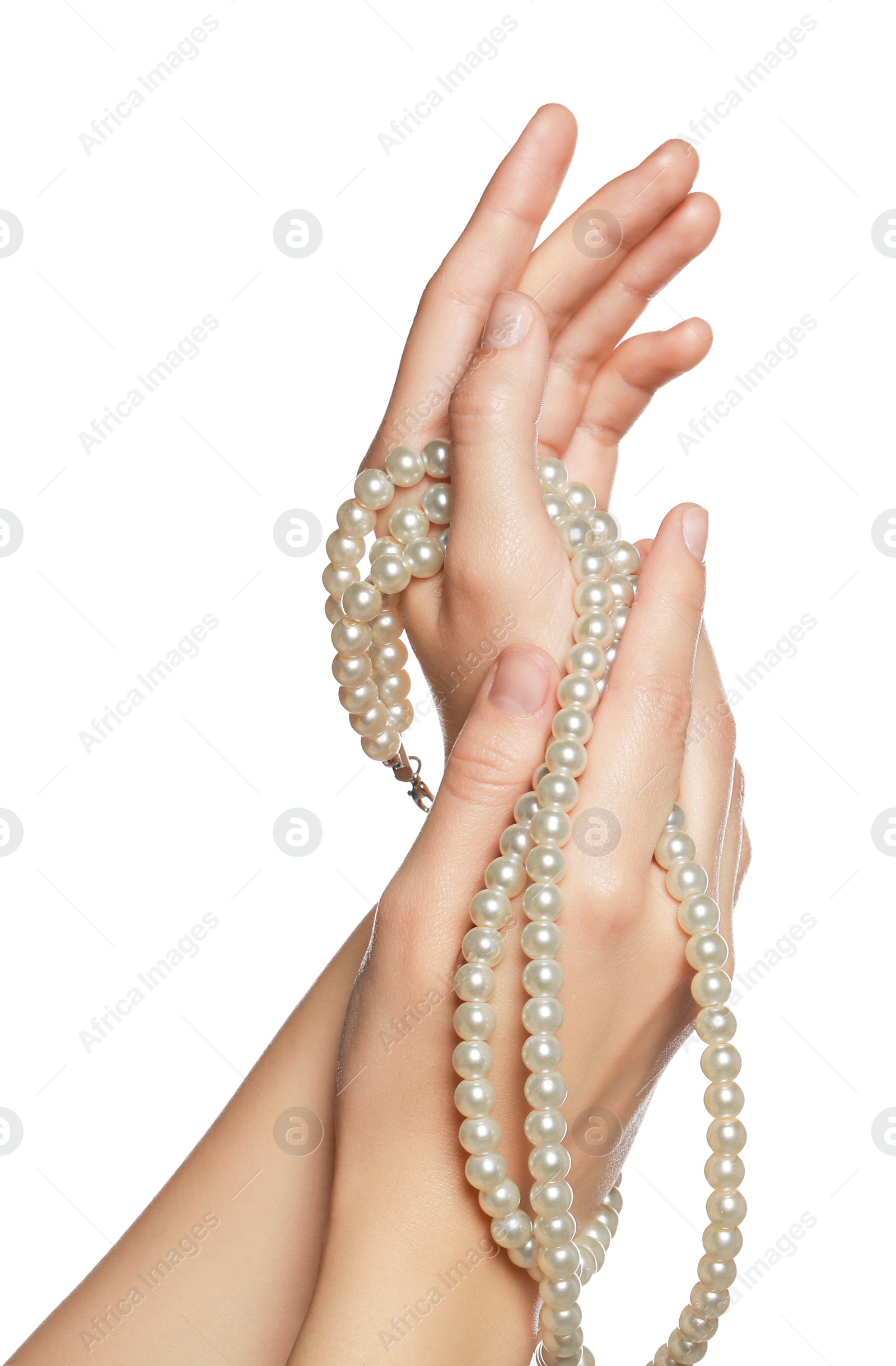 Photo of Woman holding elegant pearl necklace on white background, closeup