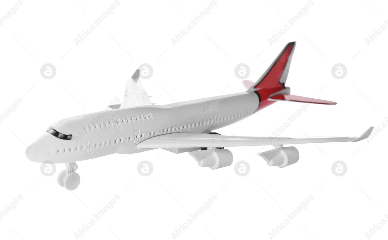 Photo of Toy airplane isolated on white. Travel concept