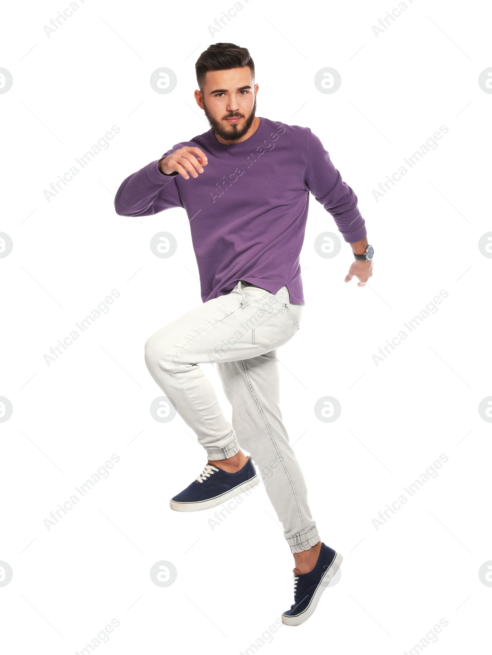 Photo of Handsome young man posing on white background