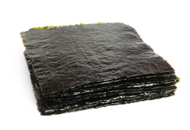 Stack of dry nori sheets on white background