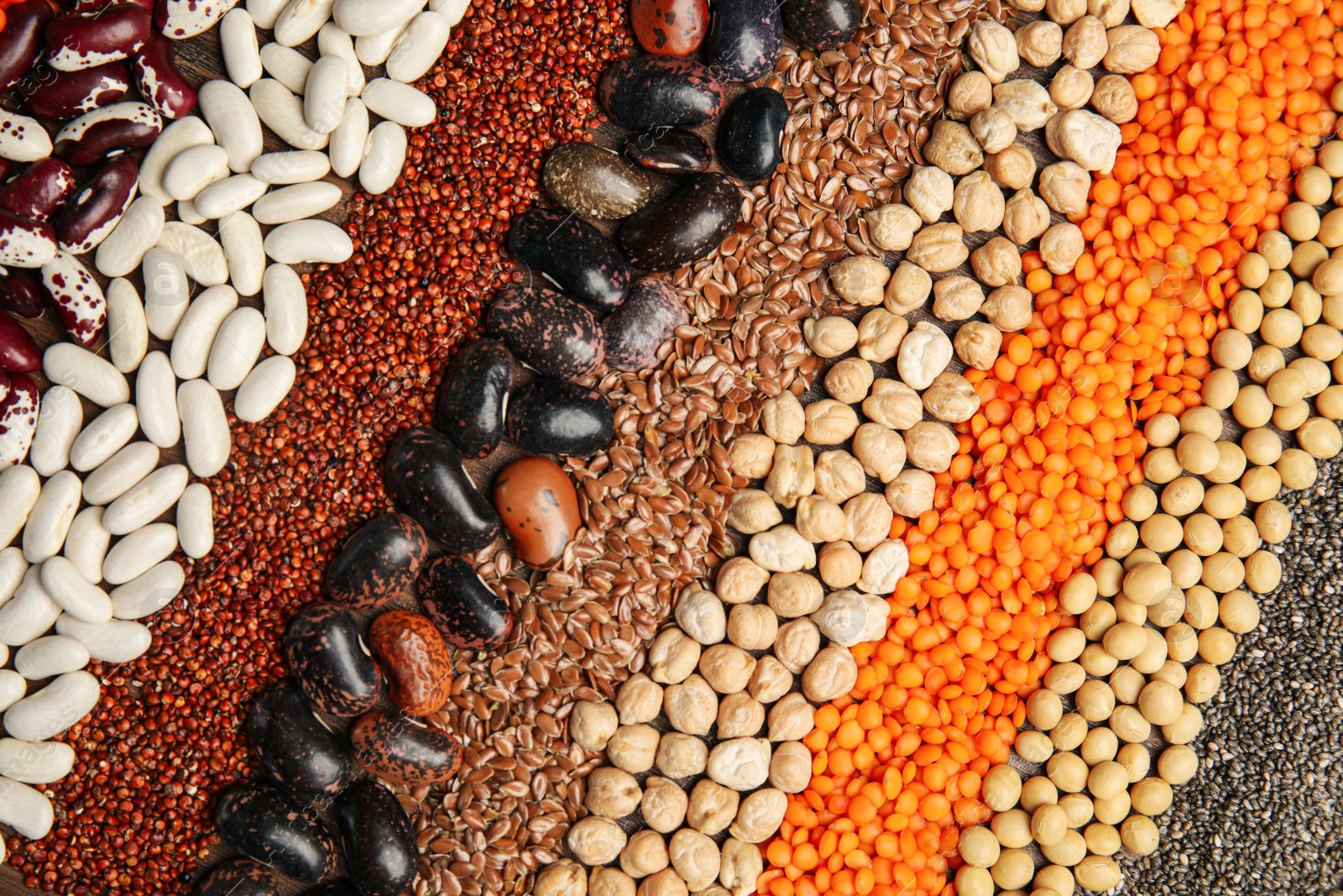 Photo of Different grains and seeds as background, top view. Veggie diet