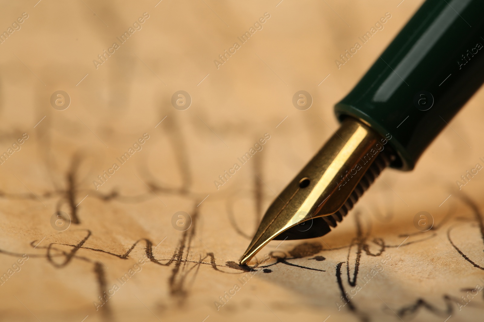 Photo of Writing letter with beautiful fountain pen, closeup